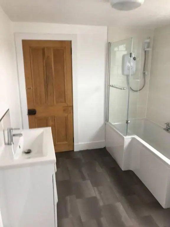 a bathroom with a tub and a sink and a shower at Traditional Family Home in Royal Deeside in Aboyne