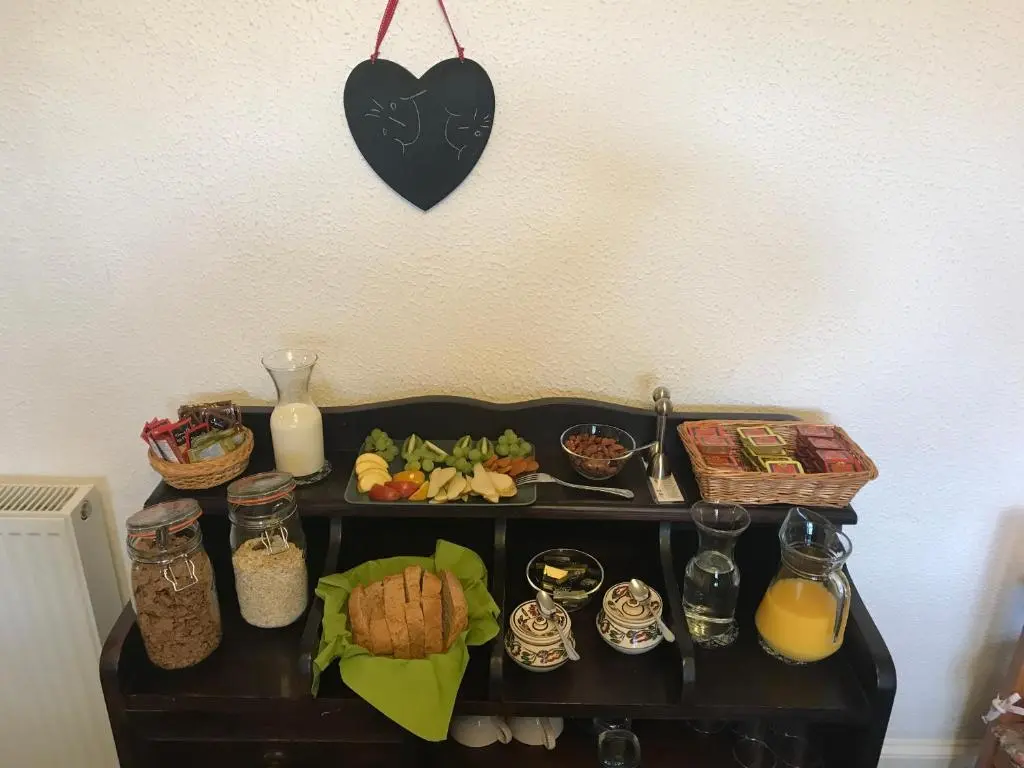 a table with a tray of food on it at Garden Park Guest House in Grantown on Spey