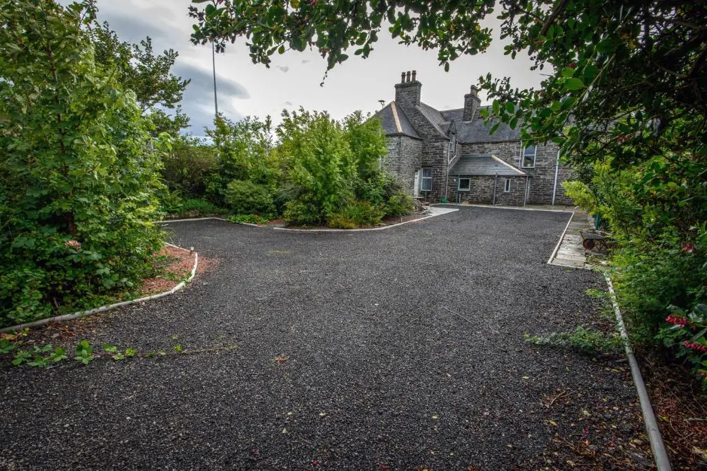 an empty driveway in front of a house at Charming Townhouse on North Coast 500 Route, Wick in Wick
