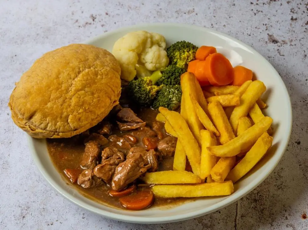 a plate of food with a sandwich and french fries at Pinehurst Lodge Hotel -Dyce, Aberdeen in Dyce
