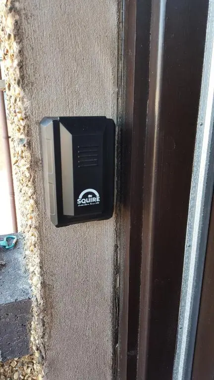 a tv on the side of a door at exploreNESS Apartment in Inverness
