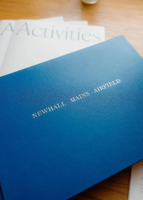 a blue book sitting on top of a desk at Newhall Mains in Resolis