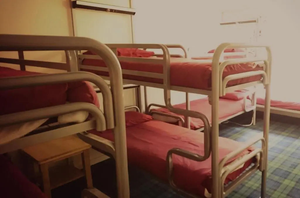 a group of bunk beds in a room at Morag's Lodge in Fort Augustus