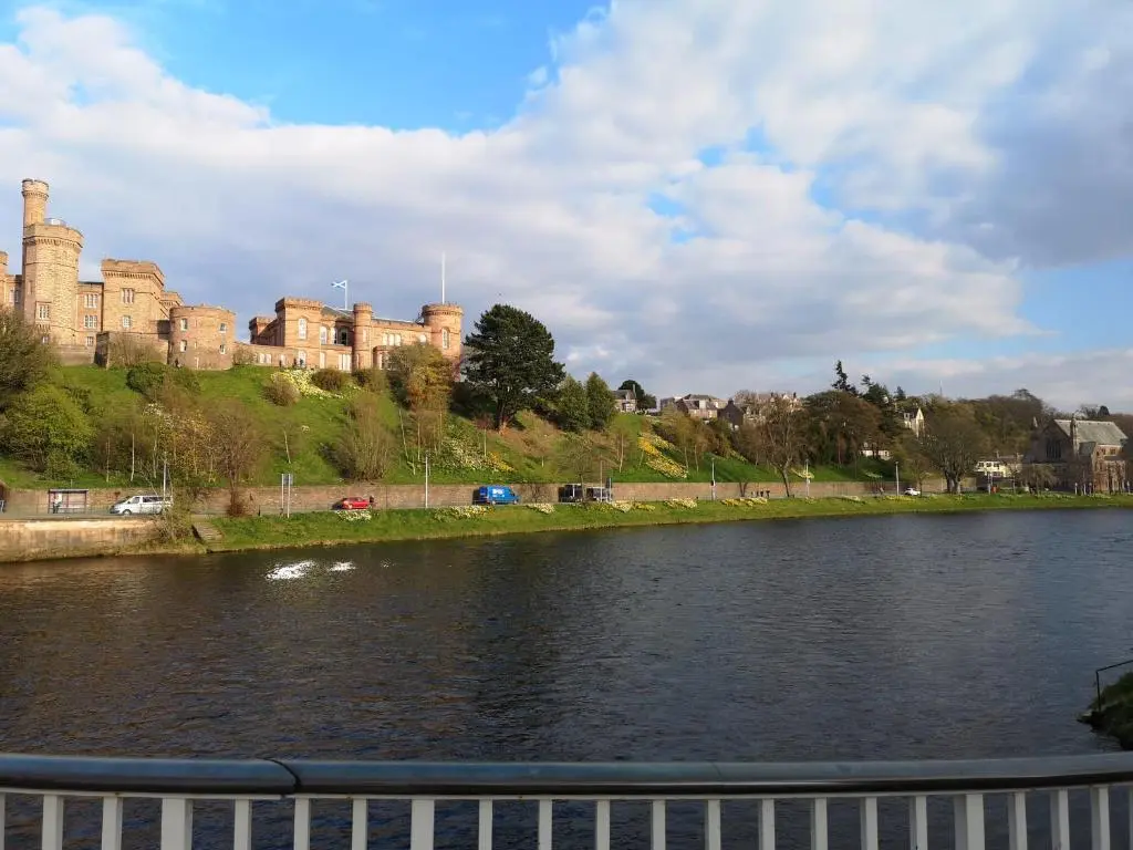 a view of a river with a castle in the background at STAG City Centre apartment in Inverness