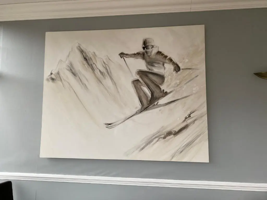 a drawing of a man skiing down a mountain at Cairngorm Guest House in Aviemore