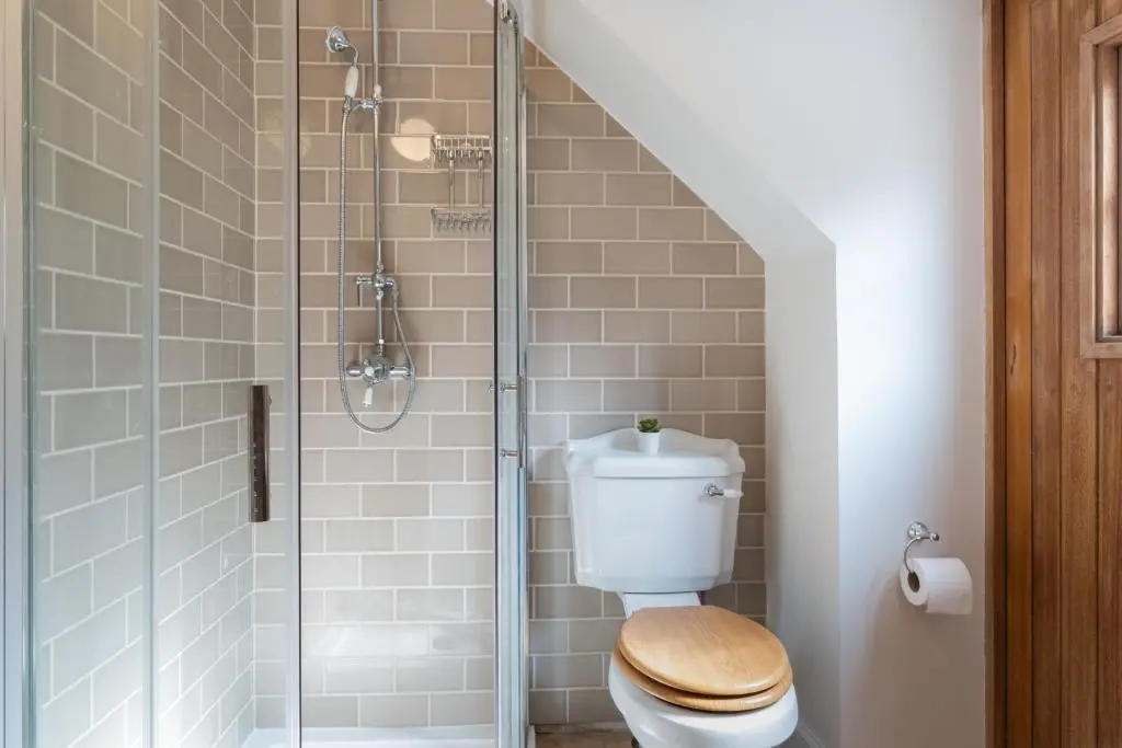 a bathroom with a toilet and a shower at The Blue Hoose in Gardenstown