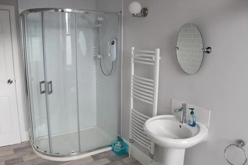 a bathroom with a shower and a sink at Beautiful house on NC500 Route in Wick