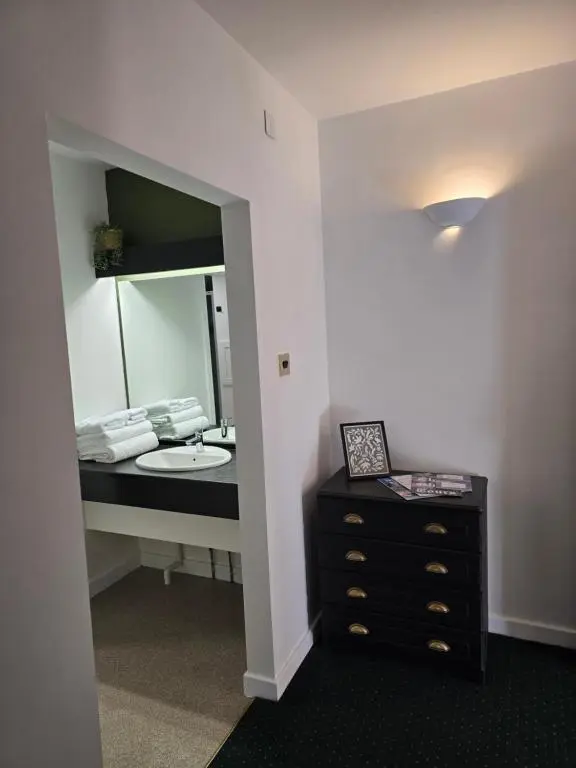 a bathroom with a sink and a mirror at The Red Lion Tavern in Fochabers