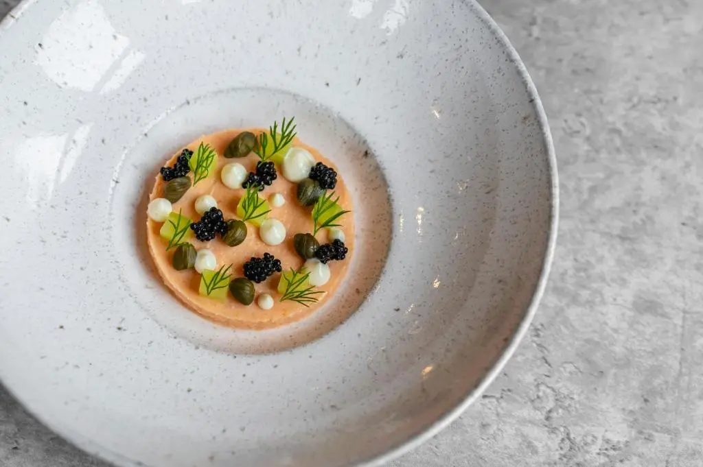 a bowl of food on a white plate at Bunchrew House Hotel in Inverness