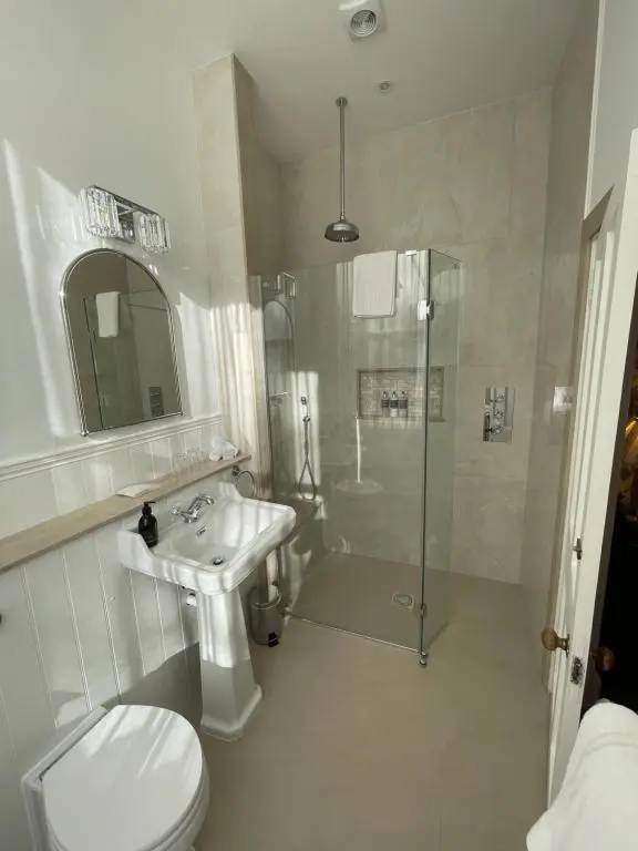 a bathroom with a toilet and a sink and a shower at Bunchrew House Hotel in Inverness