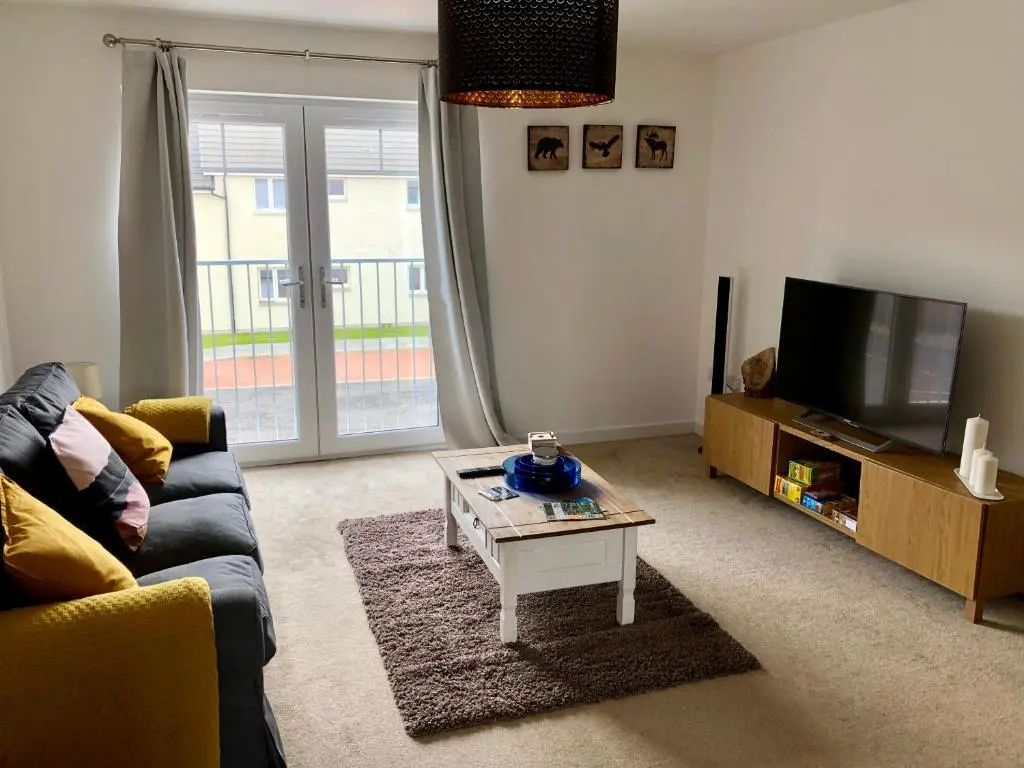 a living room with a couch and a coffee table at Stelvio in Aviemore