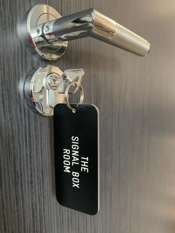 a key tag hanging from a door handle at The Station Hotel Insch in Insch