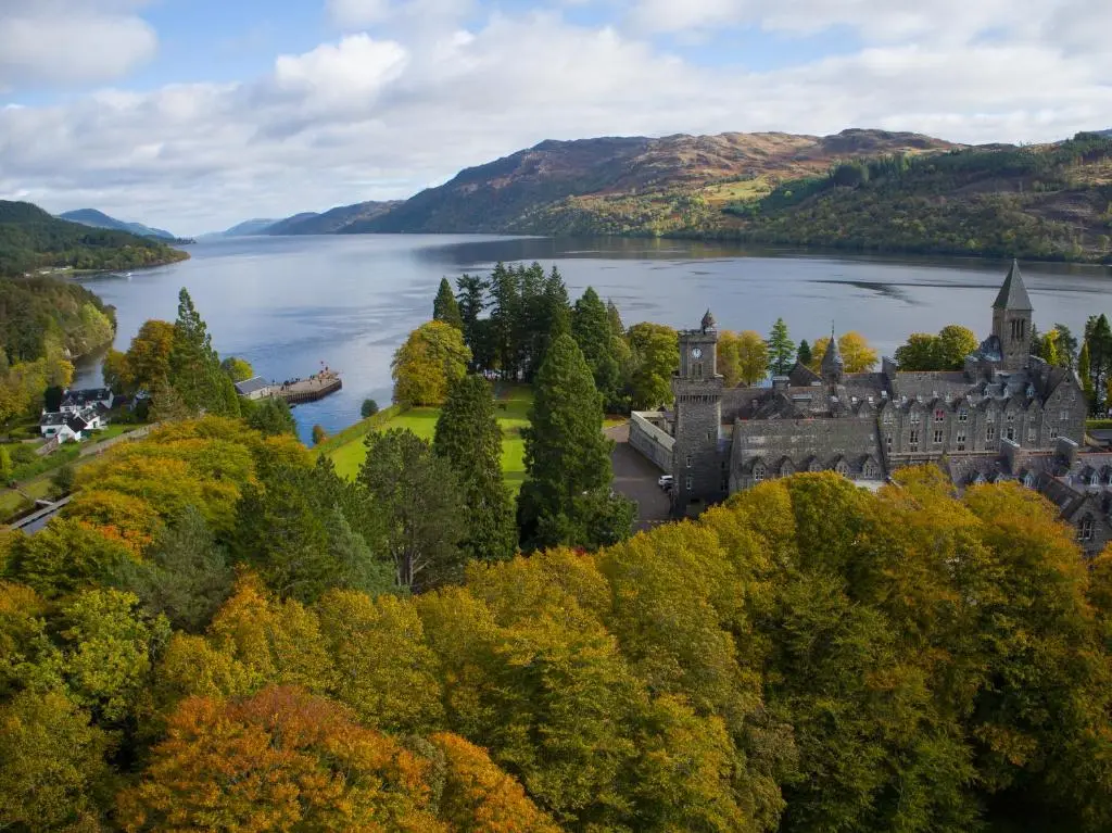 an old castle on the shore of a lake at Old School 10 Apartment With A View in Fort Augustus
