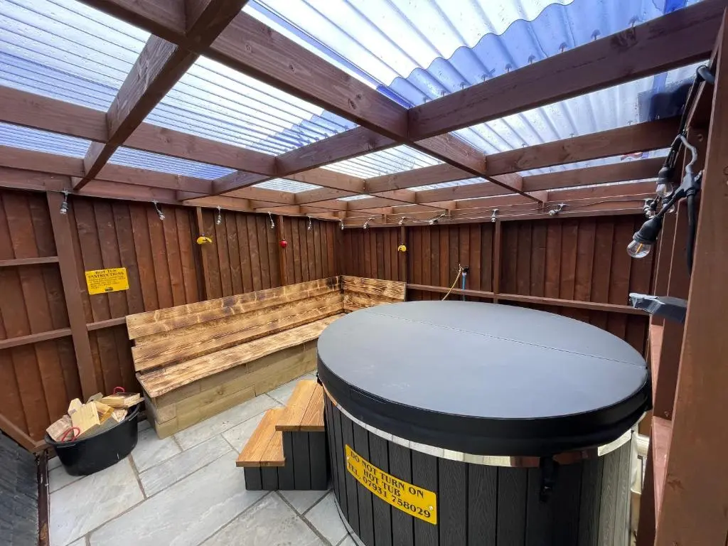 an empty sauna with a skylight in a wooden building at AC/DC Glamping in New Aberdour