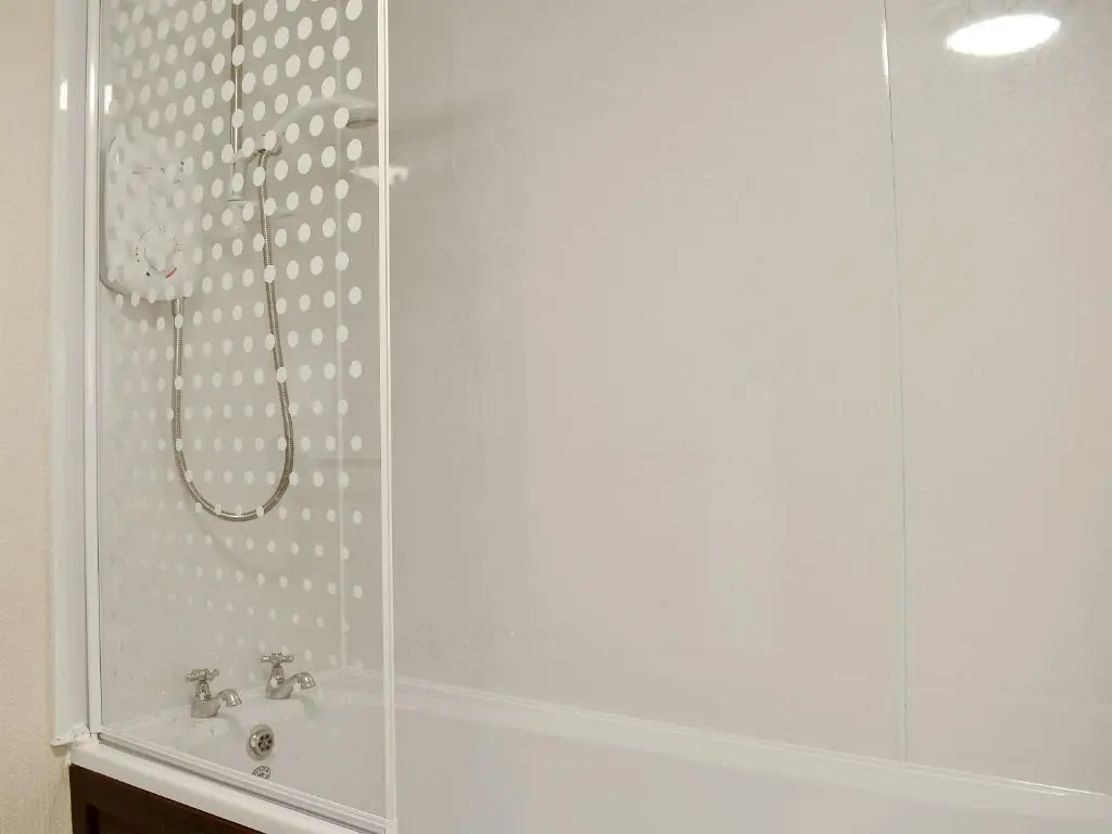a bathroom with a shower and a sink at Ben View in Orbliston