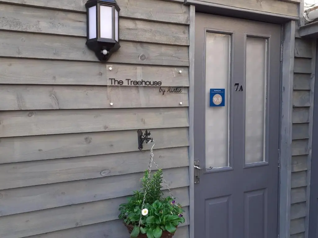 a house with a door and a wreath on it at The Treehouse by Airlie in Nairn