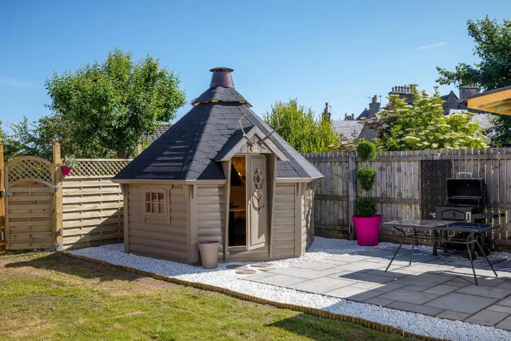 a small dog house with a black roof at Aye Stay Home, city centre in Inverness