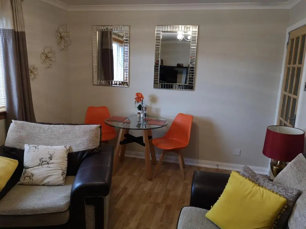 a living room with a couch and a table at Perfect Stay Apartments No.20 in Inverness