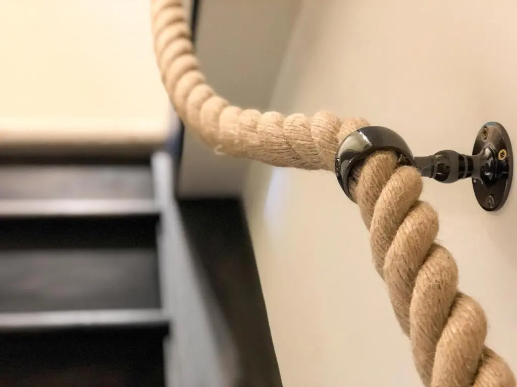 a rope attached to a wall with a hook at Nan's Cottage in Beauly