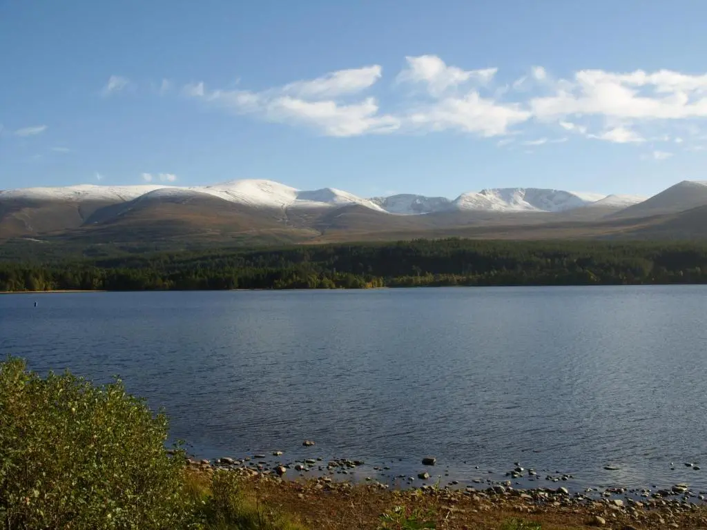 a view of a lake with mountains in the background at Cairngorm Lodge Youth Hostel in Loch Morlich