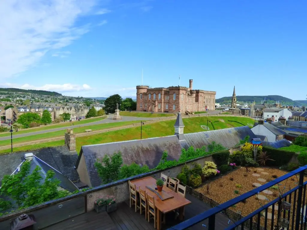 a view from the balcony of a house with a garden at Ardentorrie Guest House in Inverness