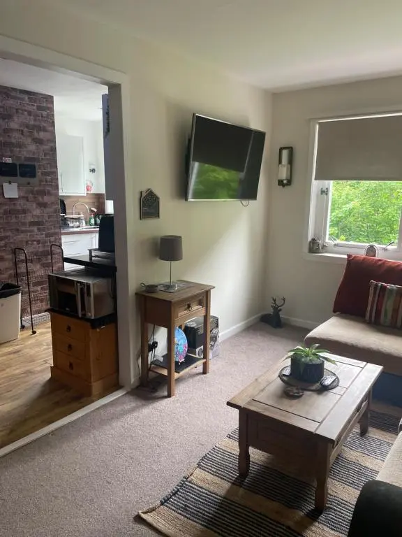 a living room with a couch and a table at Charleston Apartment One Bedroom sleeping 2 in Inverness