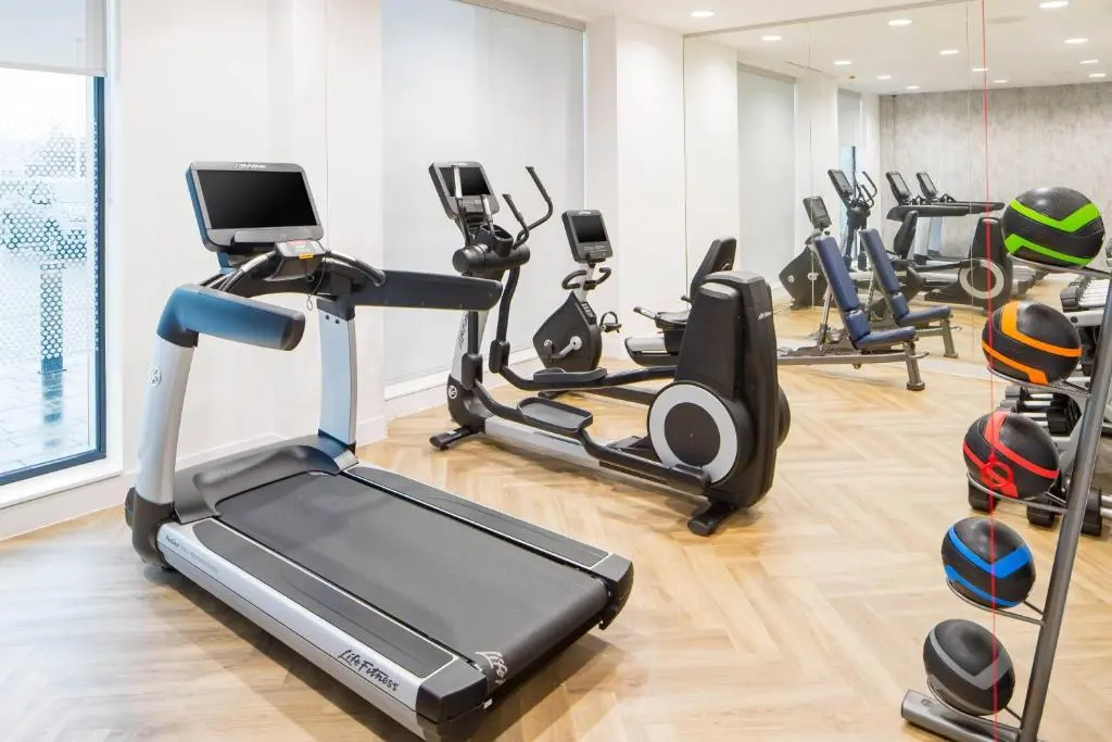 a gym with several exercise bikes and a treadmill at Courtyard by Marriott Inverness Airport in Inverness