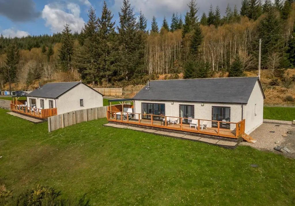 an aerial view of a house with a yard at Shoreland Lodges - Cherry Lodge in Fort Augustus