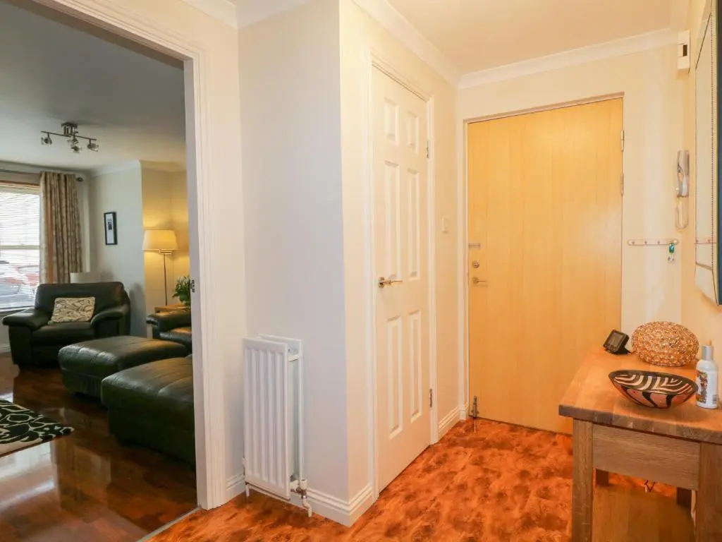 a living room with a couch and a table at 7 Riverside Gardens in Inverness