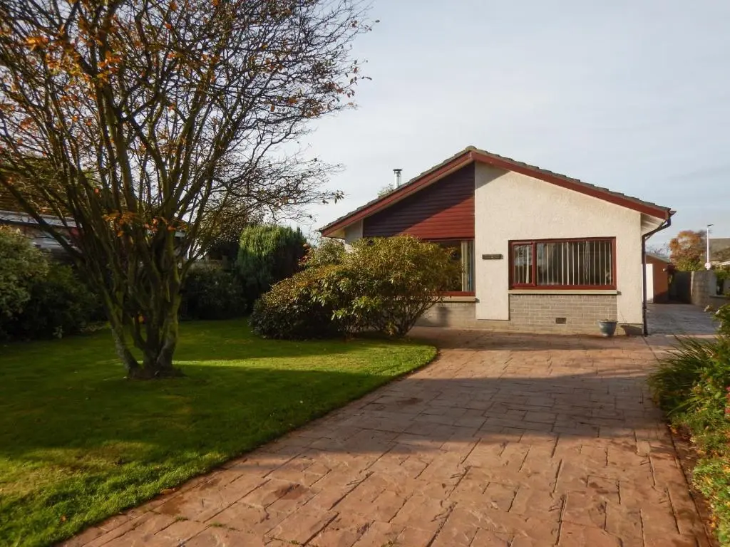 a brick driveway leading to a house at March Brown in Garmouth