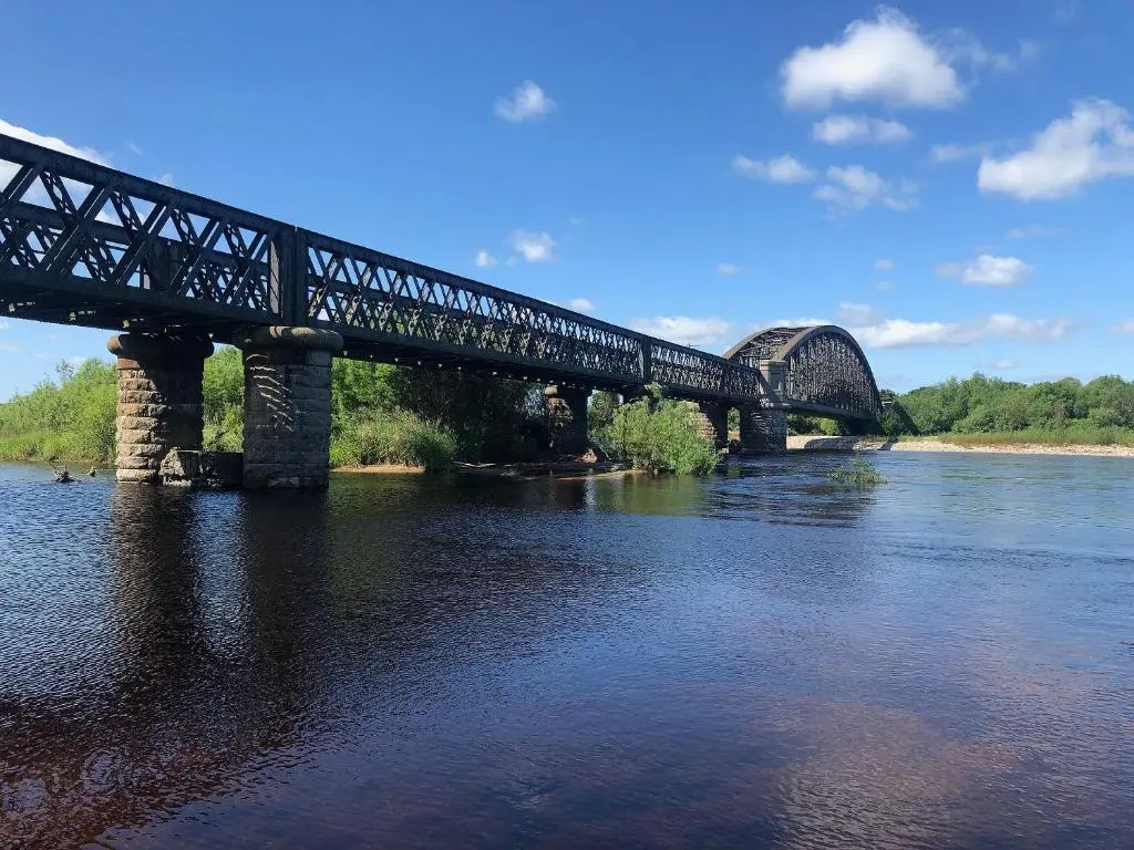 a bridge over a river with a train on it at March Brown in Garmouth