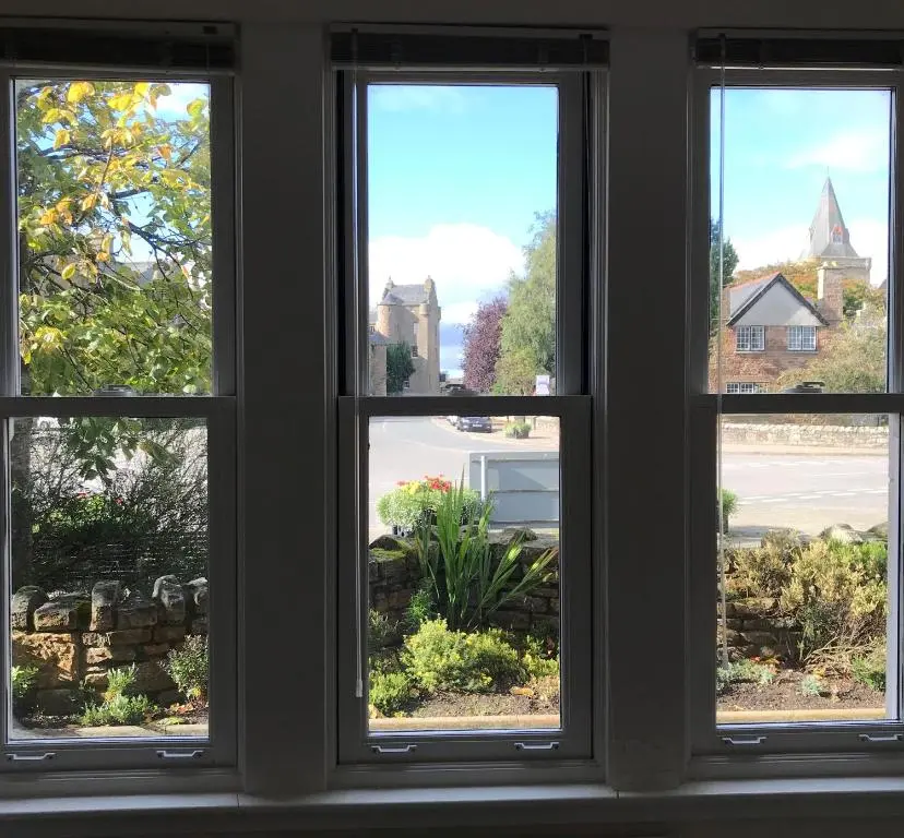 a window with a view of a yard at 3 Argyle Place in Dornoch