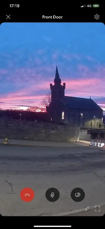 a picture of a building with a sunset in the background at Church view in Wick