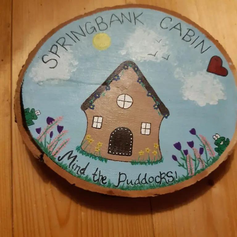 a birthday cake with a house on top of it at Springbank Cabin in Insch