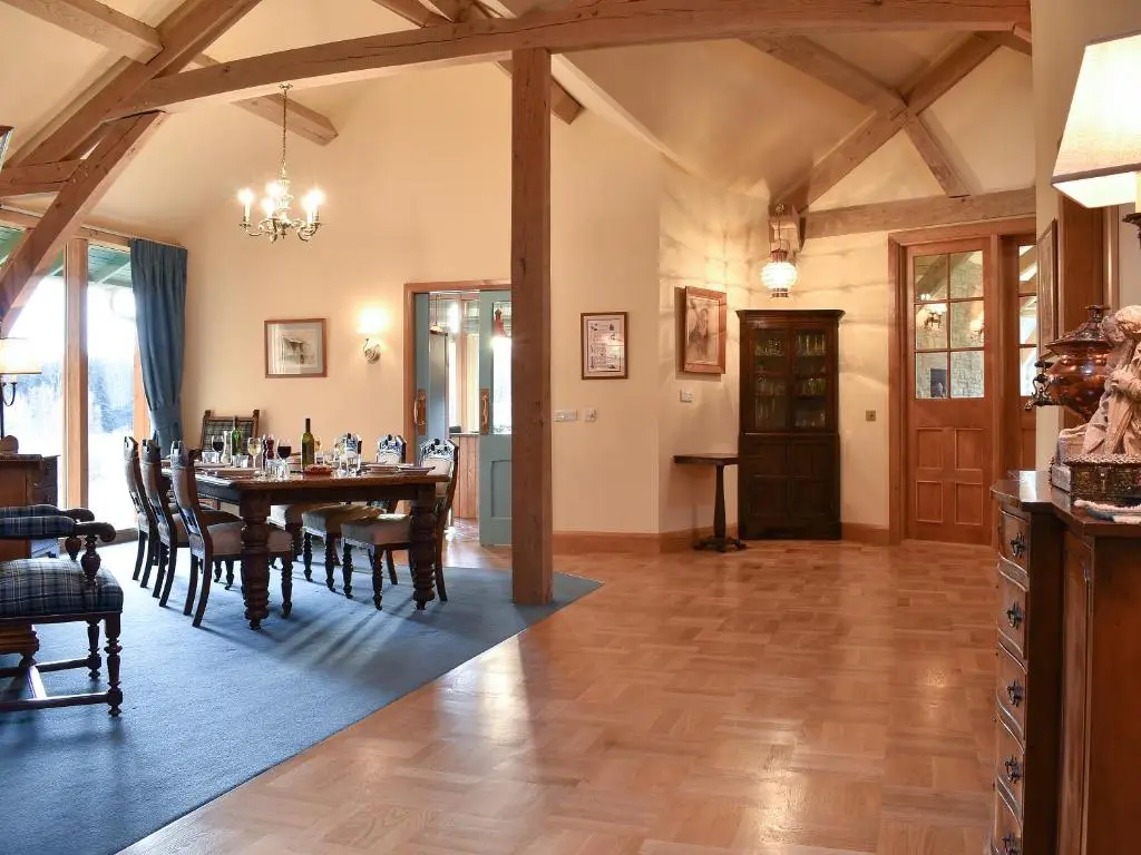 a dining room with a table and chairs at Mill Of Burncrook in Glenlivet