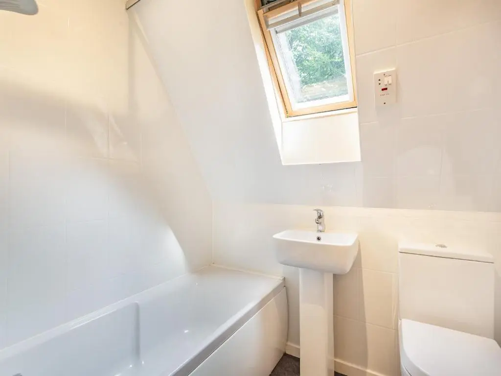 a white bathroom with a sink and a toilet at Gorse Lodge - Uk7050 in Glenurguhart
