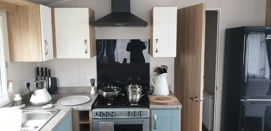 a kitchen with a stove and a sink at Bonnie Gorm in Boat of Garten