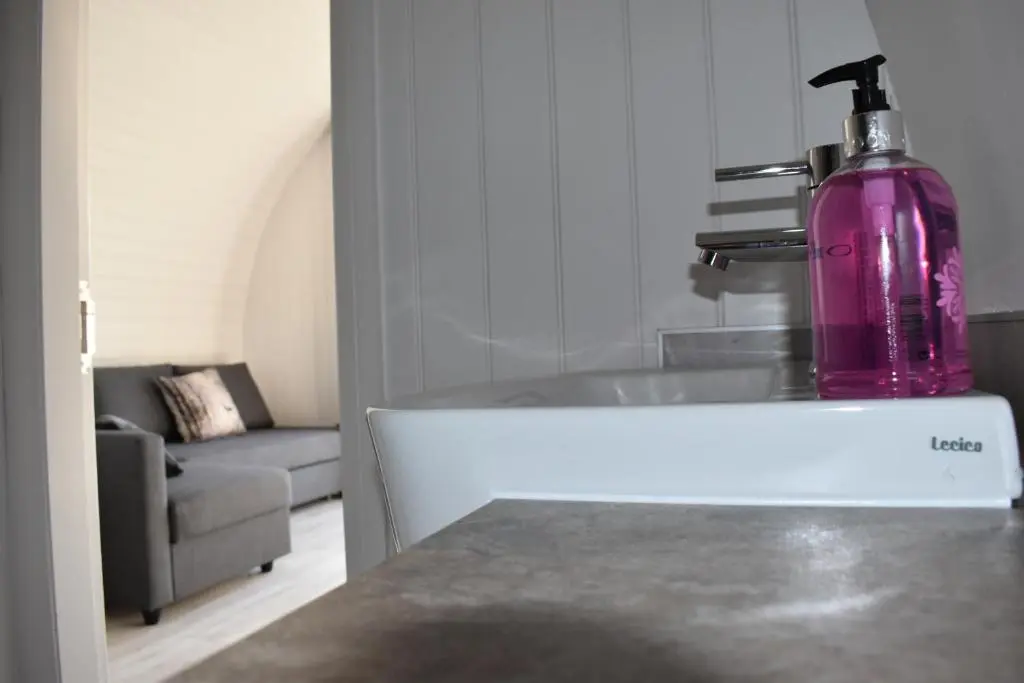 a purple bottle sitting on top of a kitchen counter at Grantown Caravan Park in Grantown on Spey