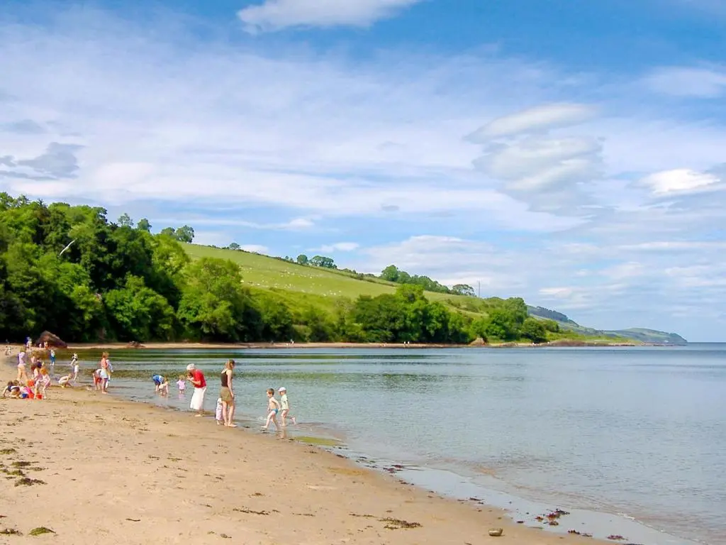 a group of people walking on the beach at Thistle Lodge - Uk7051 in Glenurguhart
