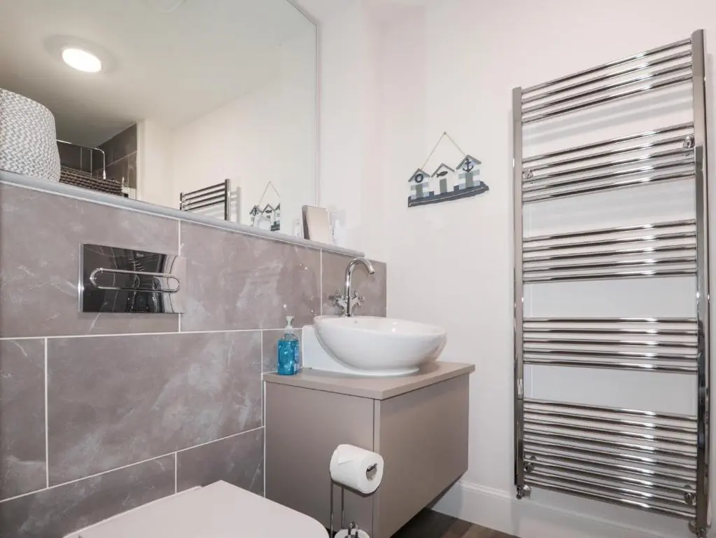 a bathroom with a sink and a toilet in it at The Nook in Inverness