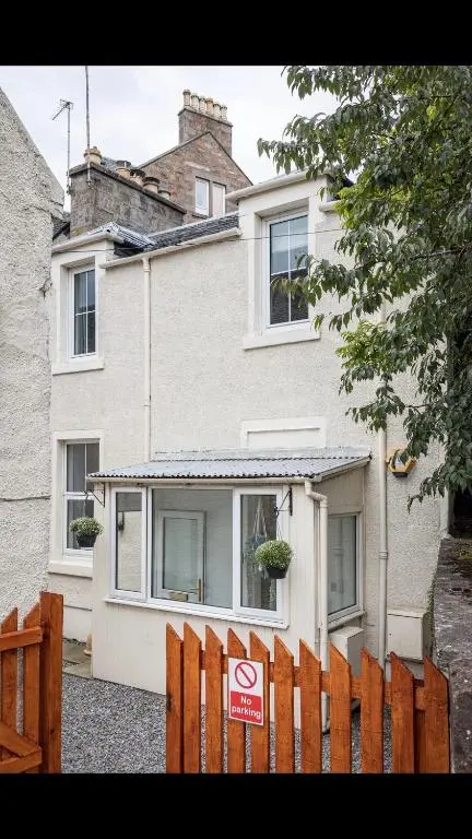 a house with a no parking sign in front of it at Lamont Cottage in Inverness