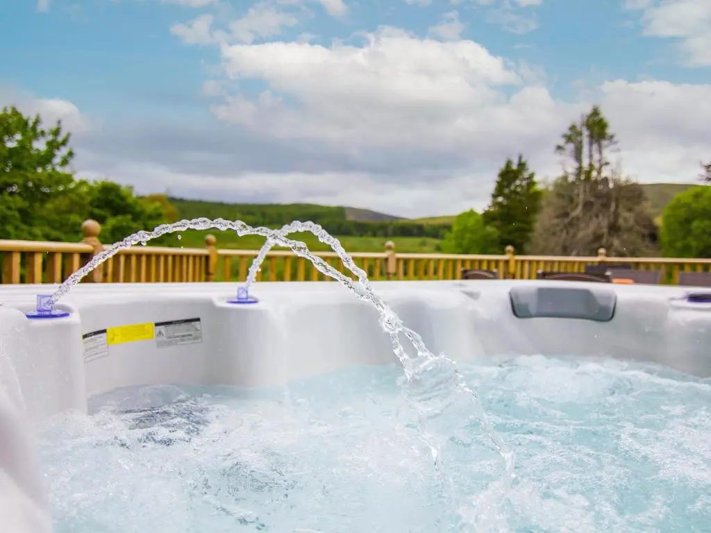 a water fountain in a swimming pool at Dalnaglar Cottage - Uk30260 in Cray