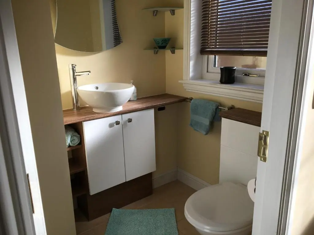 a bathroom with a sink and a toilet at Crescent Corner, Inverness in Inverness