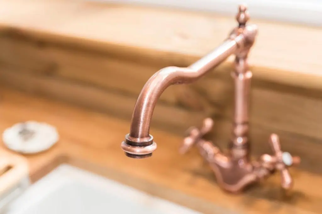 a copper faucet on a kitchen sink at The Milking Sheds, Dufftown in Dufftown