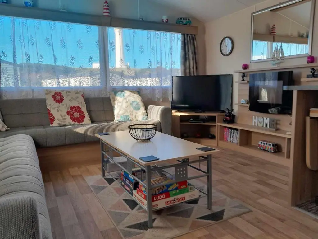 a living room with a couch and a coffee table at hollies retreat in Lossiemouth