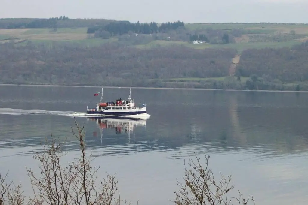 a boat on a large body of water at Herons Rest in Drumnadrochit