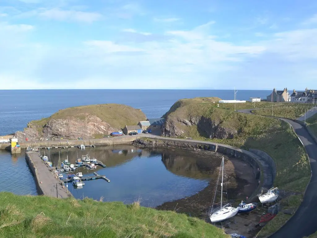 an aerial view of a harbor with boats in the water at White Gables - Uk30688 in Portknockie