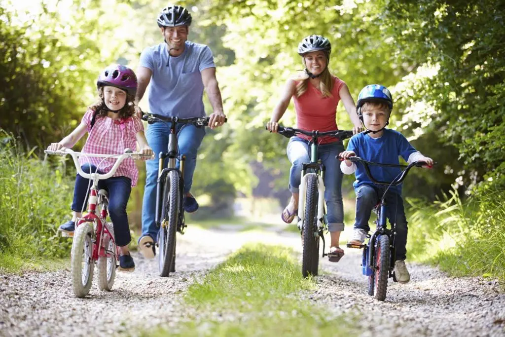 a family riding bikes down a trail at Inverness Holiday House - 2 Bedroom in Inverness