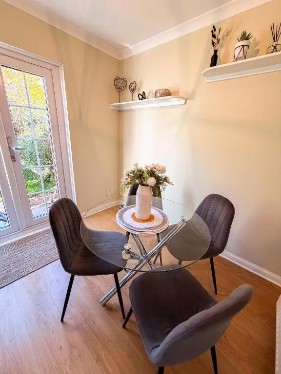 a dining room with a glass table and chairs at Inverness Holiday Retreat - 2 Bedroom in Inverness