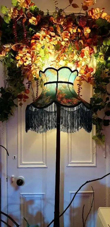 a hair brush hanging from a ceiling with flowers at The Osprey Hotel in Kingussie